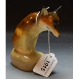 A Royal Doulton model of a seated fox,