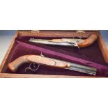 A pair of reproduction replica wall hanging dueling pistols, marked W Parker, octagonal barrels,