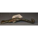 A bronze belt hook painted as a serpent,