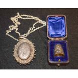 A Victorian silver lady's locket, hinged cover engraved and chased with country flowers,