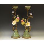 A pair of gilt metal and porcelain Chinese style candlesticks,