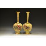 A near pair of Royal Worcester bottle vases,
