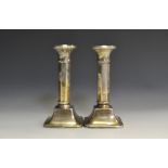A pair of Art Deco silver candlesticks,