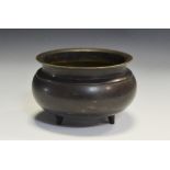 A Chinese bronze tripod incense burner