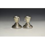 A pair of Elizabeth II silver boudoir candlesticks,