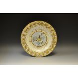 A Derby circular plate, painted with a bird surrounded by sprays of flowers and gilt leafy swags,