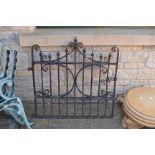 Architectural salvage - a wrought iron garden gate,