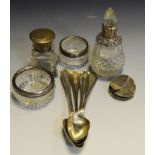 A set of four silver grapefruit spoons; a silver mounted scent bottle;