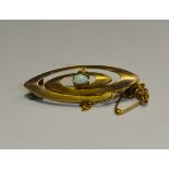 A Victorian 9ct gold and fire opal bar brooch