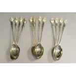 Silver - a set of twelve Barker Brothers teaspoons, MG monogram, marked Chester,