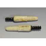 A pair of 19th century bone and horn novelty needle cases,