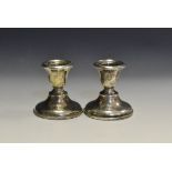 A pair of George V silver boudoir candlesticks,