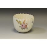 A Chelsea fluted tea bowl, painted with Meissen style summer flowers, brown line border,