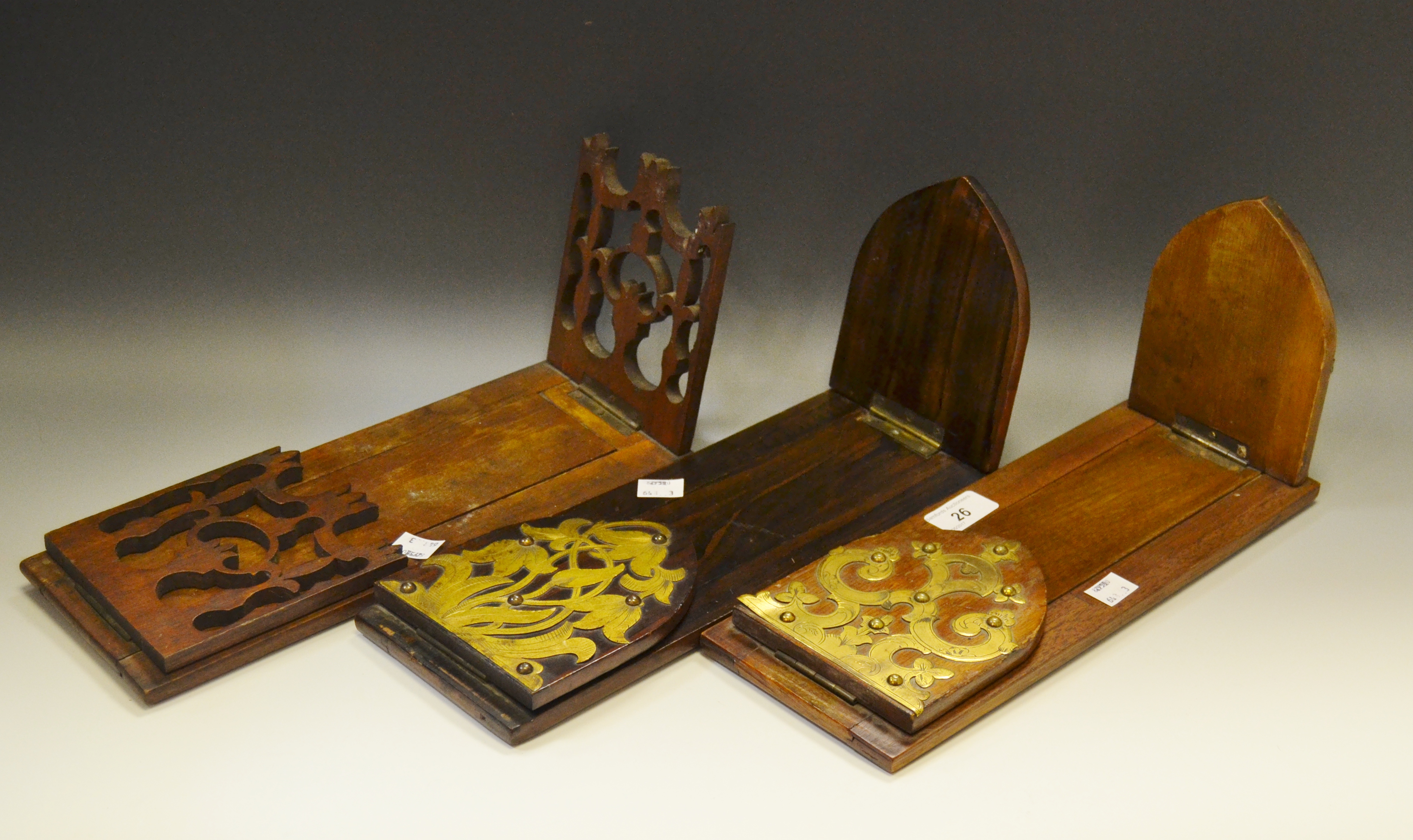 A Victorian mahogany folding book slide, applied with gilt brass cut-card work, c.