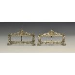 A pair of silver menu holders,