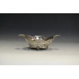 A Continental silver basket , twin handles, scrolls and floral decoration ,