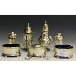 A silver condiment set comprising of a pair of salts mustard ;