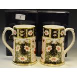 A pair of Royal Crown Derby 2451 pattern spreading cylindrical mugs, Millennium 2000, 13.