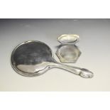 A silver octagonal compact, engine turned, Chester 1941; a silver backed hand mirror ,