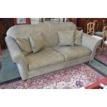 A Wesley Barrell Hinton three seat sofa of large proportions, shaped back, scrolling arms,