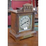 An Edwardian oak cased mantel clock, Walker,