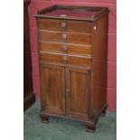 An Edwardian four drawer music cabinet, two door cupboard to base.