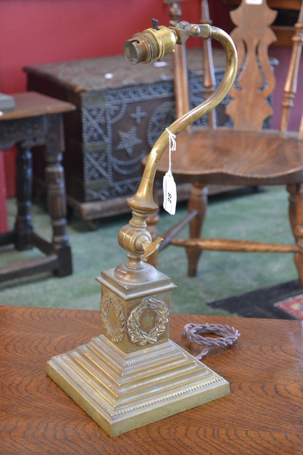 A heavy brass adjustable desk lamp