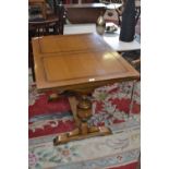 An oak drawleaf table.