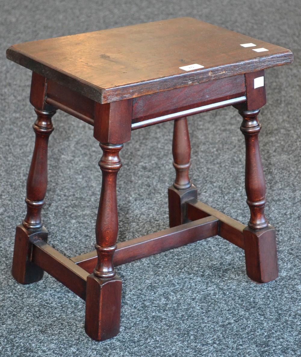 An early 20th century oak stool.