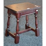 An early 20th century oak stool.