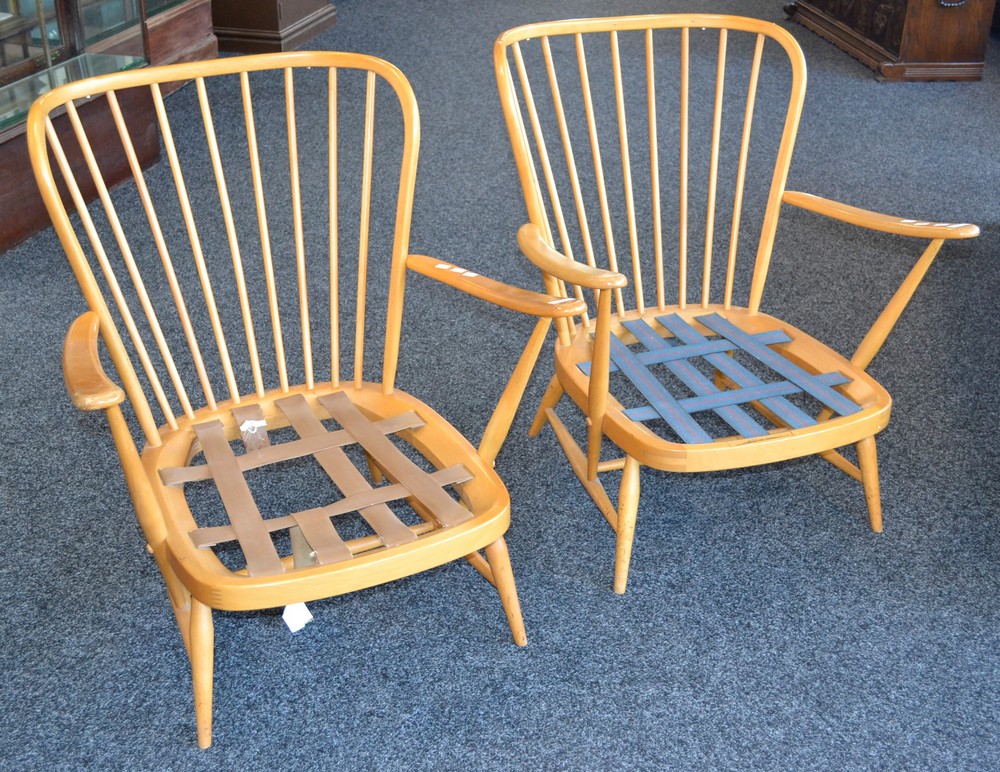 A pair of Ercol spindle back armchairs