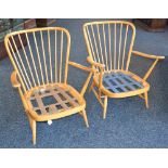 A pair of Ercol spindle back armchairs