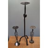A cast iron 24" tall pricket candlestick;