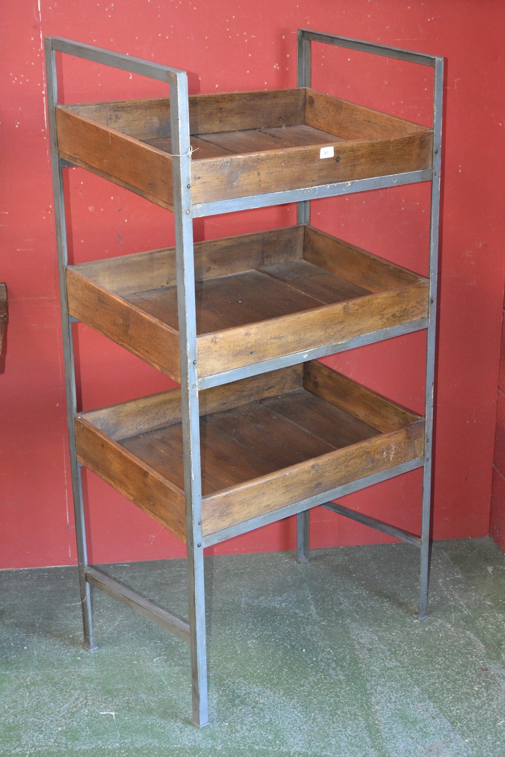 A rustic grocers three tier display stand, metal frame, plank constructed trays, 145cm high,