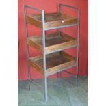 A rustic grocers three tier display stand, metal frame, plank constructed trays, 145cm high,