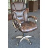 A faux leather rise and fall office swivel chair