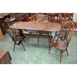 A large Ercol refectory style table, four Ercol spindle back dininf chairs,