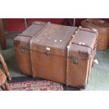 A vintage wood bound travel trunk,
