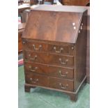 A mahogany bureau of small proportions, fall front enclosing pigeon holes, four drawers,