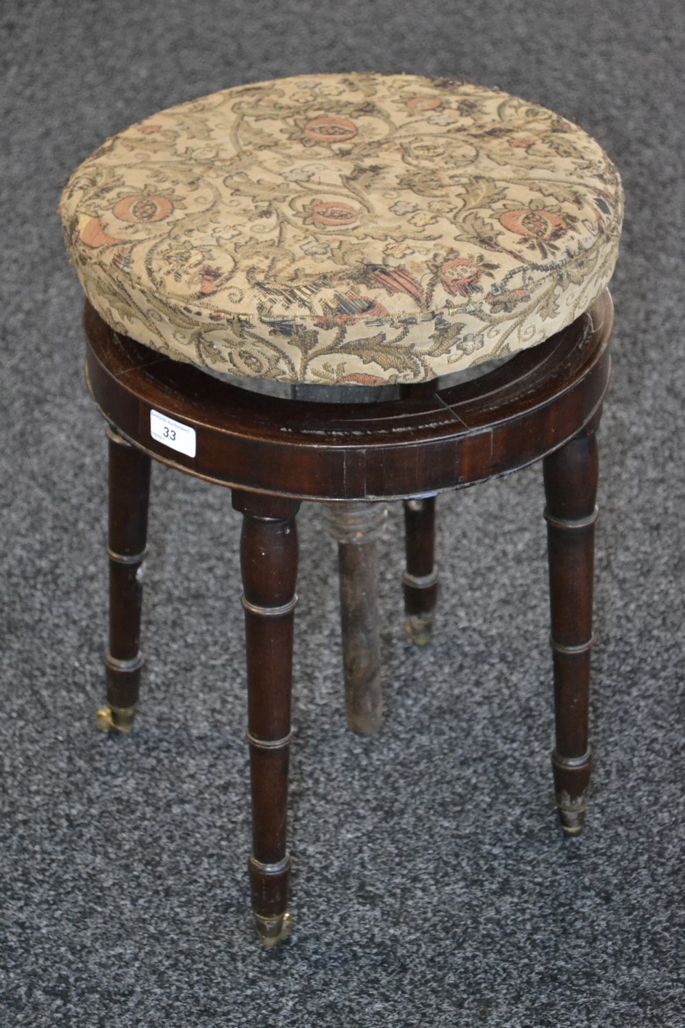 A George IV mahogany adjustable piano stool, c.