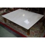 A large modern marble topped coffee table. 35cm high x 152.5cm long x 123cm wide.