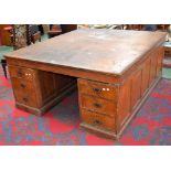 A large oak partners desk, oversailing top,