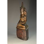 A Chinese lacquered carving, as a seated Buddhavista, 22cm high,