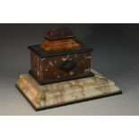 A 19th century marble sarcophagus inkstand, constructed of varying specimens, loose-fitting top,