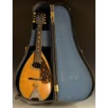 A 20th century eight-string mandolin, by John E.