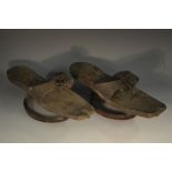 A pair of 18th century pattens/shoes, leather quarters embossed with neoclassical urns and scrolls,