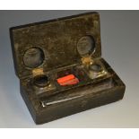 A 19th century ebonised scribe's box, hinged cover enclosing wells, seals and wax,