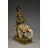 An Indo-Chinese/Tibetan polychrome painted softwood and gesso model, of Buddha on an elephant,