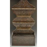 A 19th century oak spoon rack, shaped back carved withflowerheads and stiff acanthus,