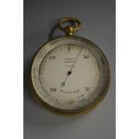 An early 20th century lacquered brass travelling pocket barometer 6cm silvered register inscribed